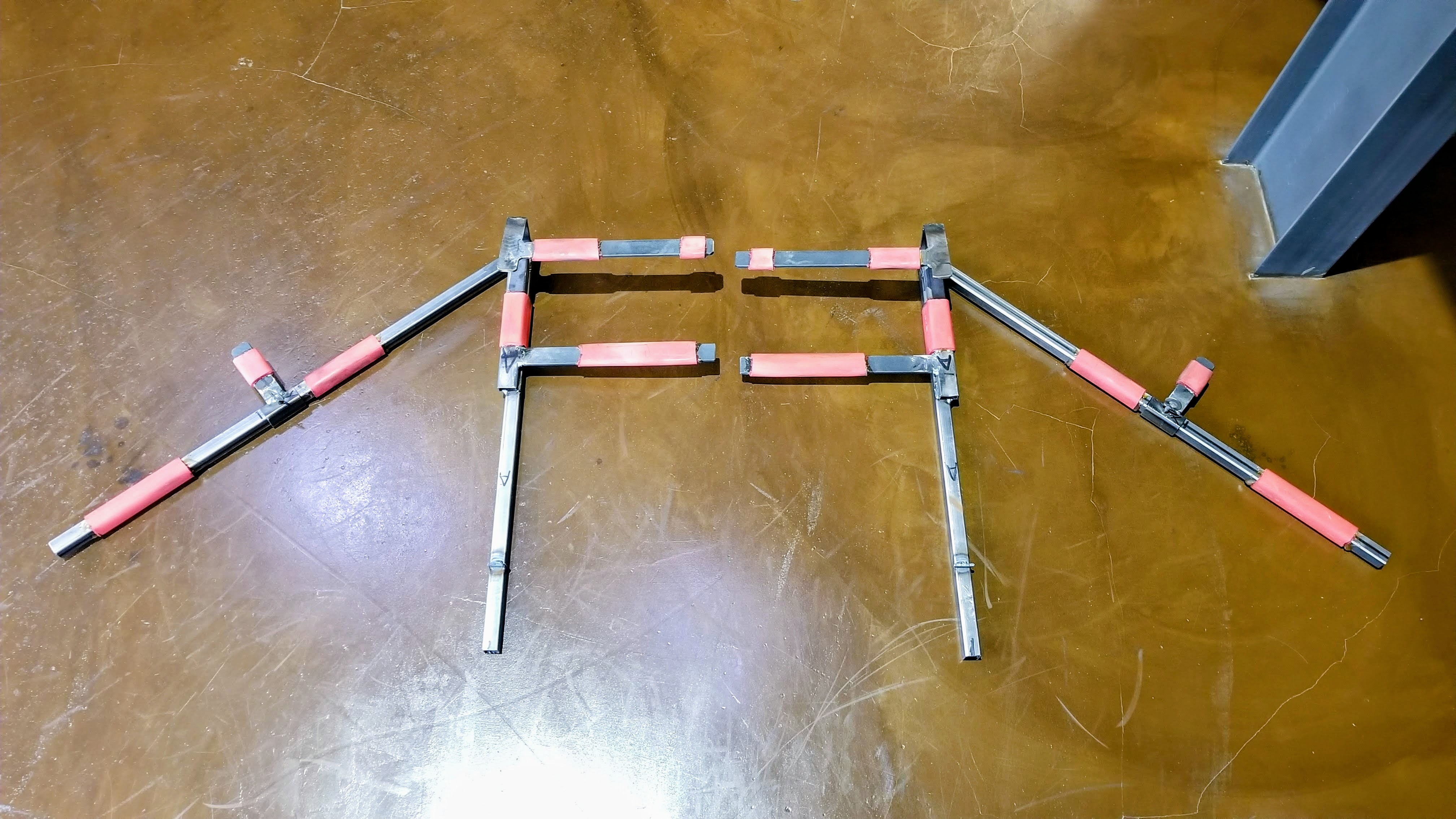 Custom bracing jig holding Method Effects aero parts in shape during paint curing