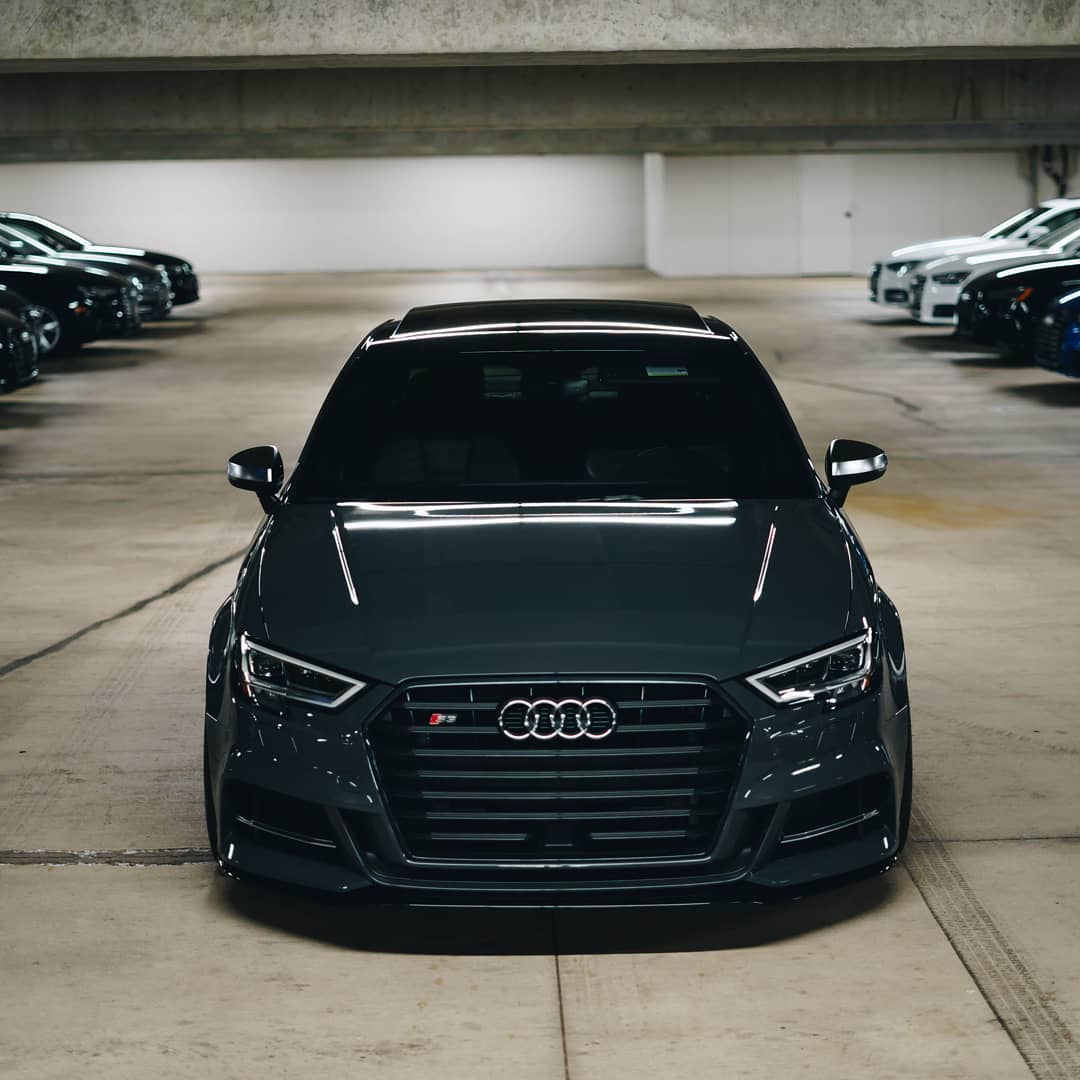 Grey Audi S3 head-on in a parking garage
