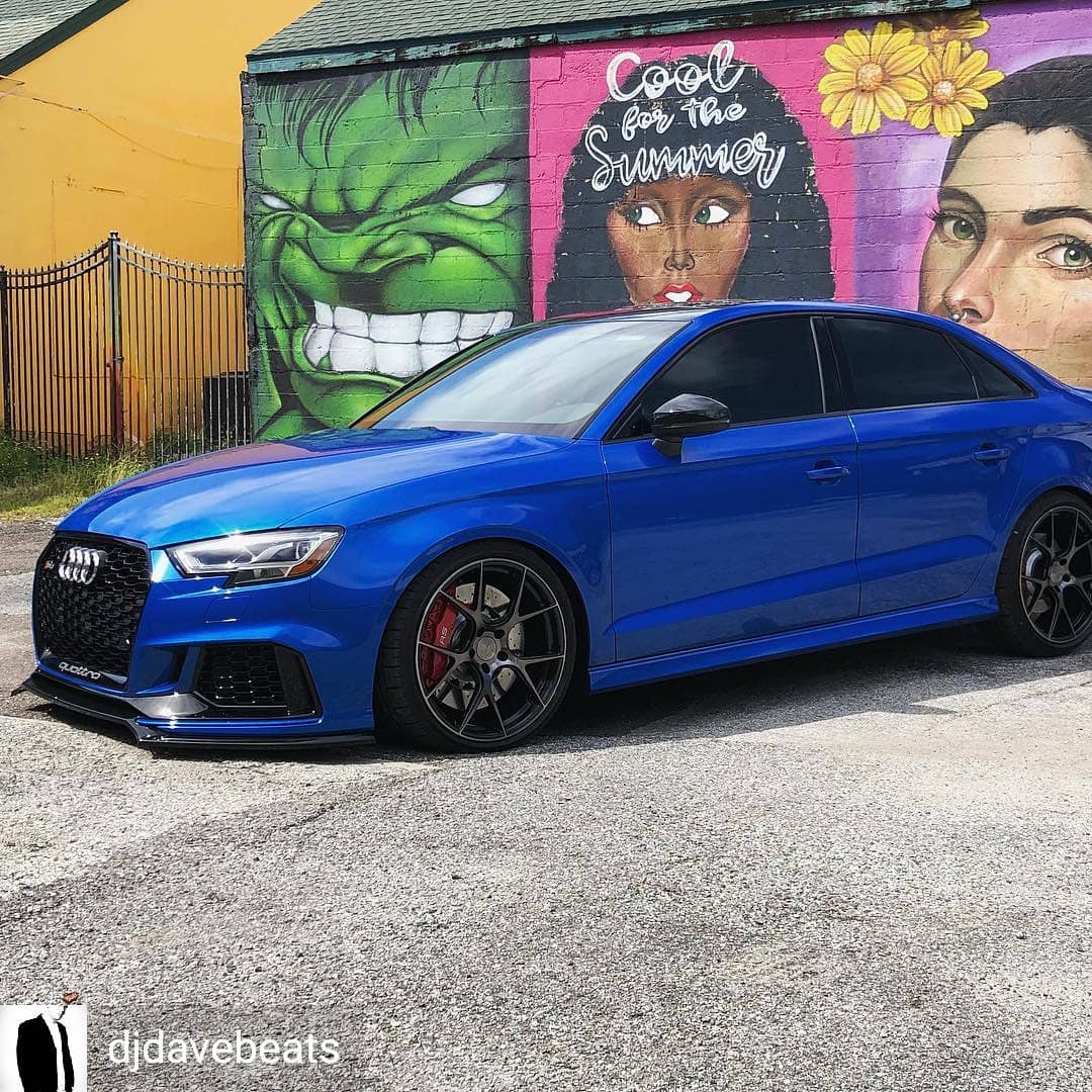 Blue Audi RS3 with Method Effects splitter parked in front of a painted mural